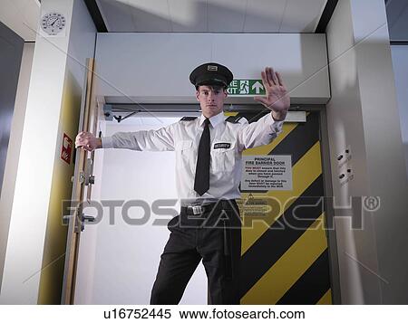 Stock Photography - Security guard in doorway. Fotosearch