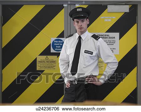 Security guard in front of door View Large Photo Image Stock Photograph - Security guard in front of door. Fotosearch