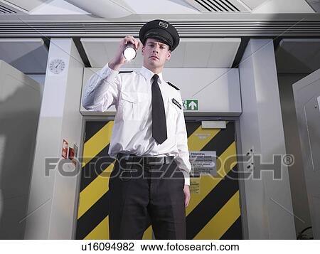 Stock Image - Security guard with torch. Fotosearch