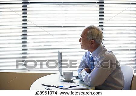 Senior businessman working in cafe View Large Photo Image Picture - Senior businessman working in cafe. Fotosearch