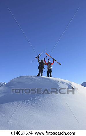 Skiers on top of mountain View Large Photo Image Picture - Skiers on top of mountain. Fotosearch