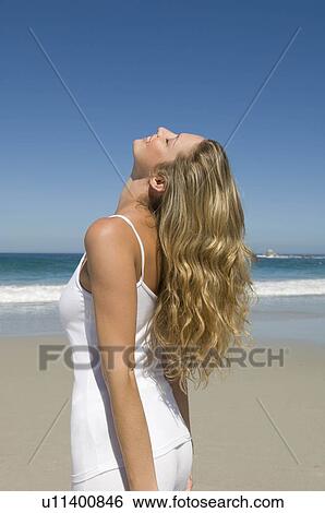 Smiling female on beach View Large Photo Image Stock Photograph - Smiling female on beach. Fotosearch