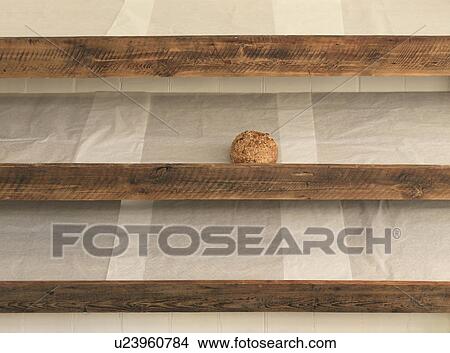 Sole remaining bread on shelf in bakery View Large Photo Image Picture - Sole remaining bread on shelf in bakery. Fotosearch