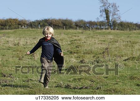 Super Hero boy in countryside View Large Photo Image Stock Photography - Super Hero boy in countryside. Fotosearch