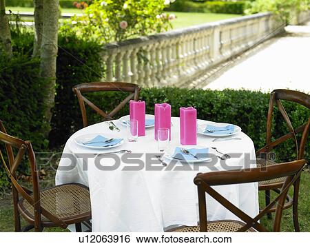 Table set outside View Large Photo Image Stock Photograph - Table set outside. Fotosearch