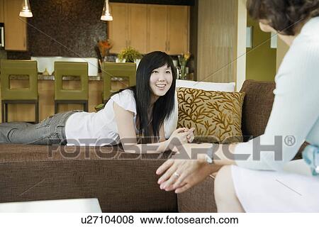 Teen girl talking with her mother View Large Photo Image Stock Photo - Teen girl talking with her mother. Fotosearch