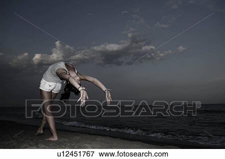 Stock Photo - Teenager making gymnastics. Fotosearch