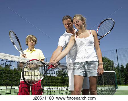 Stock Image - Tennis lesson under the heat. Fotosearch