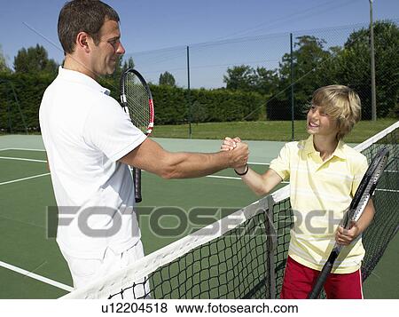 Stock Photo - Tennis lesson under the heat. Fotosearch