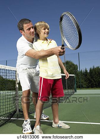 Stock Photograph - Tennis lesson under the heat. Fotosearch