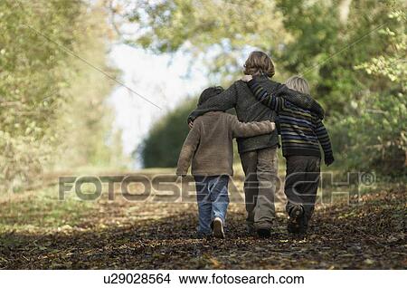 Three boys walking up country lane View Large Photo Image Picture - Three boys walking up country lane. Fotosearch