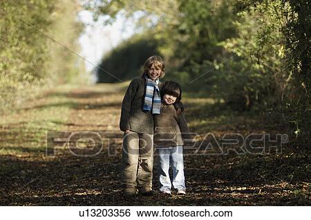 Stock Photograph - Two boys on country lane. Fotosearch