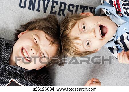 Picture - Two brothers laughing. Fotosearch