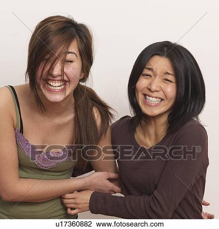 Stock Image - Two women laughing. Fotosearch