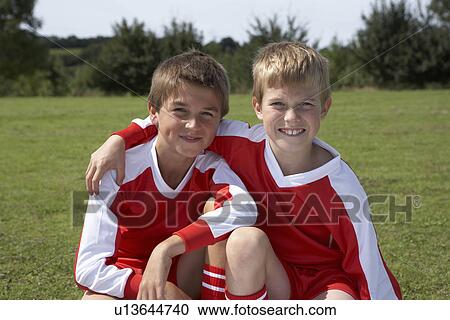 Two young footballers View Large Photo Image Stock Image - Two young footballers. Fotosearch