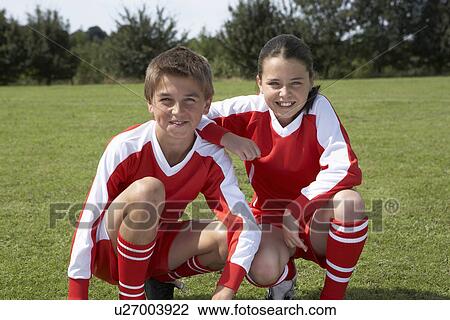 Two young footballers View Large Photo Image Stock Image - Two young footballers. Fotosearch