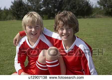 Two young footballers View Large Photo Image Stock Photo - Two young footballers. Fotosearch
