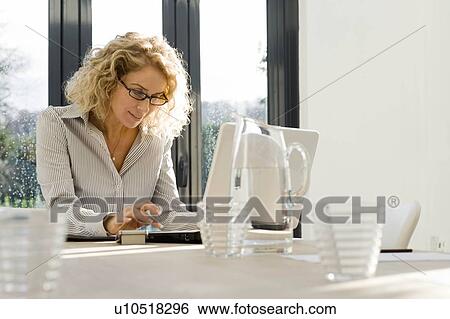 Woman at work on the computer View Large Photo Image Stock Photograph - Woman at work on the computer. Fotosearch
