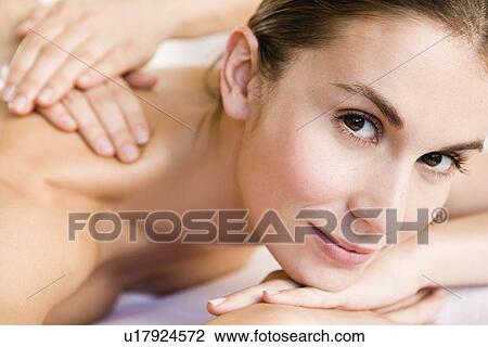 Stock Image - Woman being massaged. Fotosearch