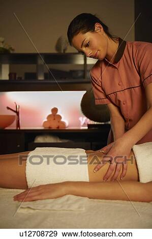 Stock Photo - Woman being massaged. Fotosearch