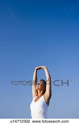 Stock Image - Woman doing yoga. Fotosearch