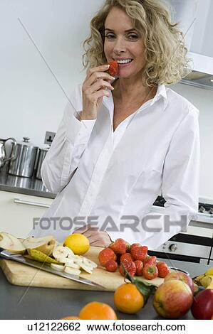 Woman eating View Large Photo Image Stock Image - Woman eating. Fotosearch