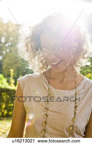 Stock Image - Woman enjoying leisure time. Fotosearch