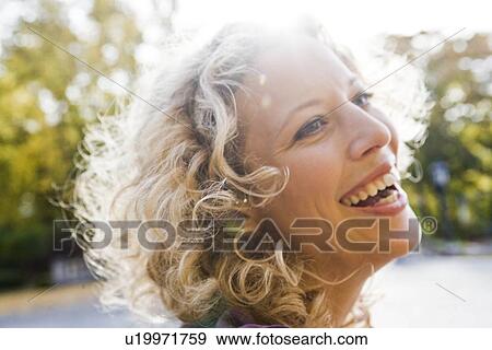 Stock Photo - Woman enjoying leisure time. Fotosearch