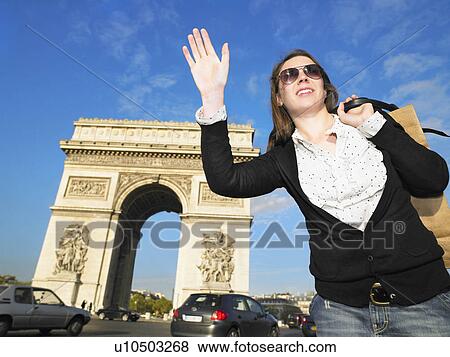 Stock Photo - Woman hailing cab. Fotosearch