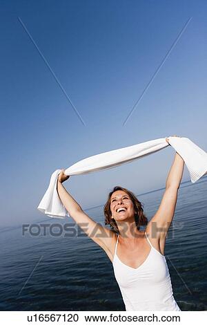 Stock Image - Woman having fun. Fotosearch