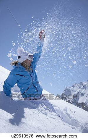 Woman jumping in snow View Large Photo Image Stock Photograph - Woman jumping in snow. Fotosearch