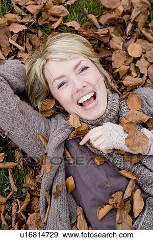 Stock Photo - Woman laughing at viewer. Fotosearch