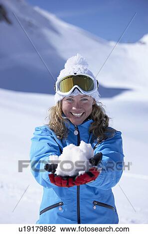 "Woman laughing, holding snowball" View Large Photo Image Stock Image - "Woman laughing, holding snowball". Fotosearch