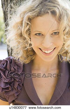Stock Photo - Woman looking at viewer. Fotosearch