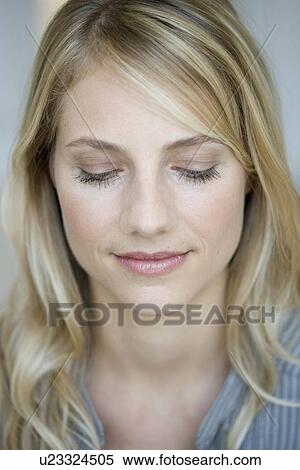 Stock Photography - Woman looking at viewer. Fotosearch