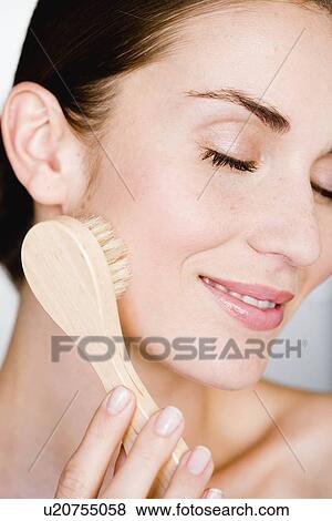 Woman peeling her face View Large Photo Image Stock Photo - Woman peeling her face. Fotosearch