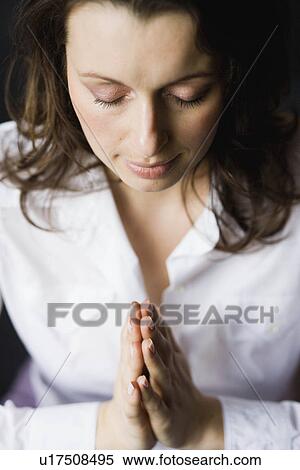 Woman praying View Large Photo Image Stock Photography - Woman praying. Fotosearch