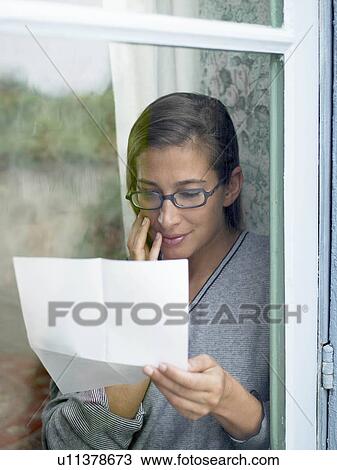 Woman reading a letter View Large Photo Image Stock Image - Woman reading a letter. Fotosearch