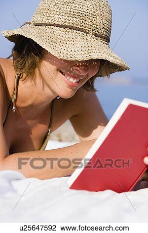 Woman reading book View Large Photo Image Stock Image - Woman reading book. Fotosearch