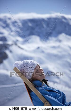 Woman reclining in deck chair View Large Photo Image Stock Photograph - Woman reclining in deck chair. Fotosearch