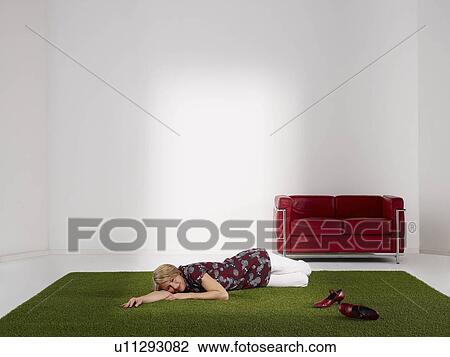 Woman relaxing on grass View Large Photo Image Stock Image - Woman relaxing on grass. Fotosearch