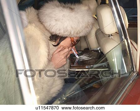 Woman snorting cocaine in luxury car View Large Photo Image Stock Image - Woman snorting cocaine in luxury car. Fotosearch