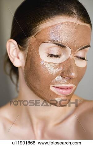 Woman with face mask on View Large Photo Image Stock Photo - Woman with face mask on. Fotosearch