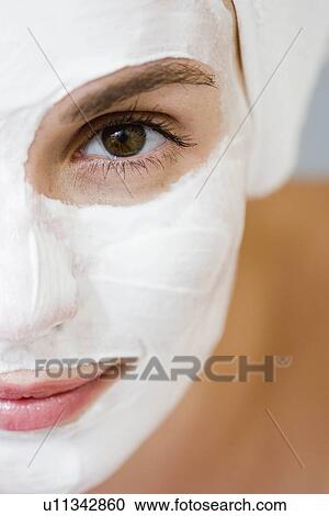 Stock Image - Woman with face mask. Fotosearch