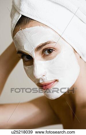 Stock Photo - Woman with face mask. Fotosearch
