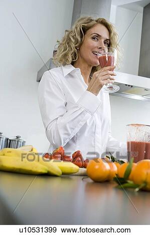 Stock Photo - Woman with healthy drink. Fotosearch