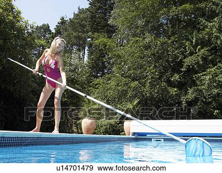 Stock Photo - Women cleaning pool. Fotosearch
