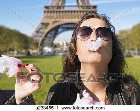 Stock Image - Women in front of Eiffel tower. Fotosearch