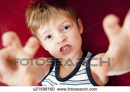 Young boy acting like a monster View Large Photo Image Stock Image - Young boy acting like a monster. Fotosearch