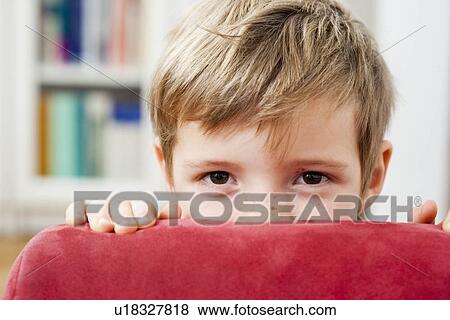 Young boy hiding View Large Photo Image Stock Photo - Young boy hiding. Fotosearch